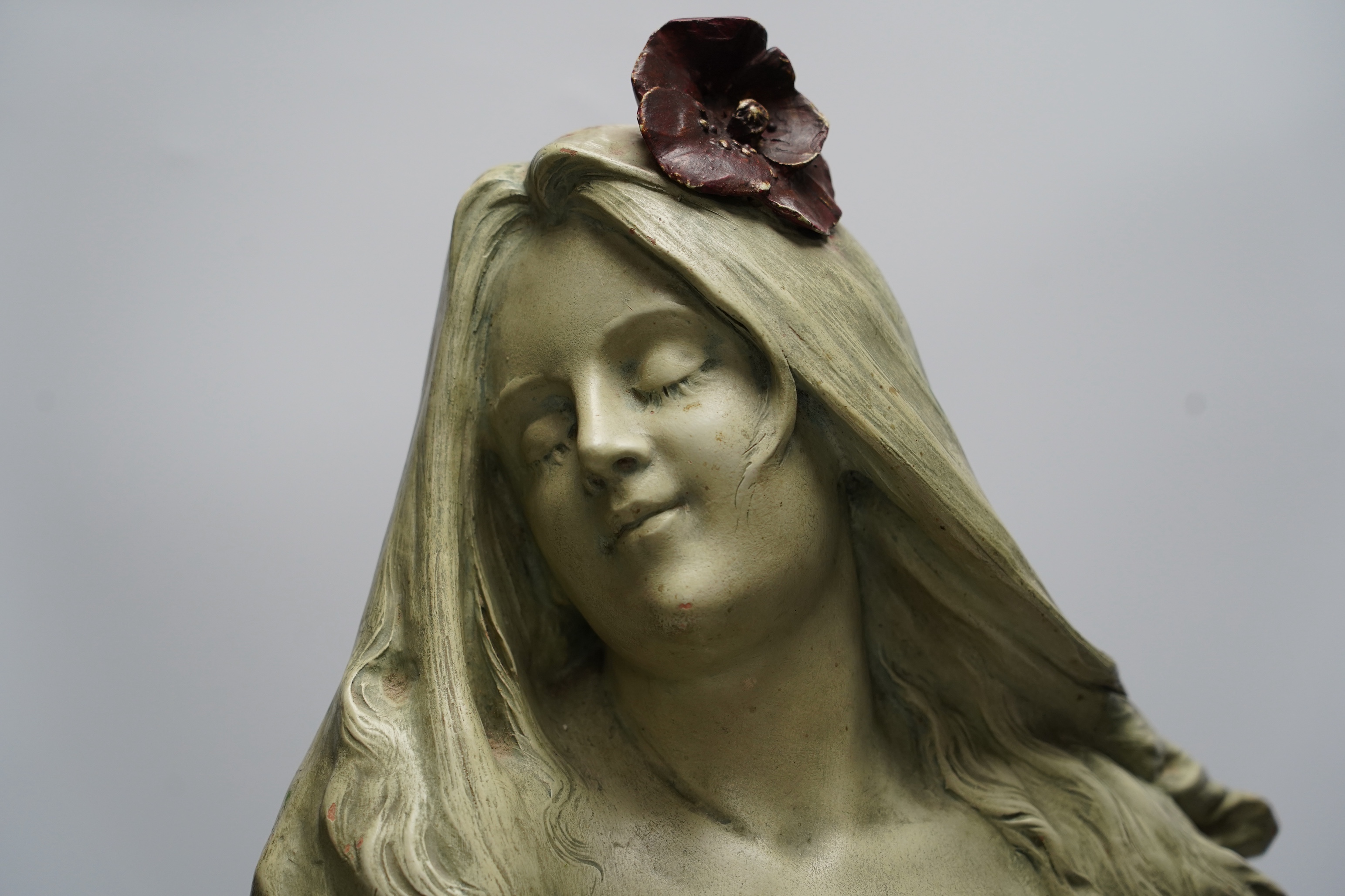 Rene Charles Masse (French, 1855-1913), an Art Nouveau figural terracotta bust 'Pavots', modelled with poppies in her hair and around the plinth, signed, 31cm wide, 63cm high. Condition - fair